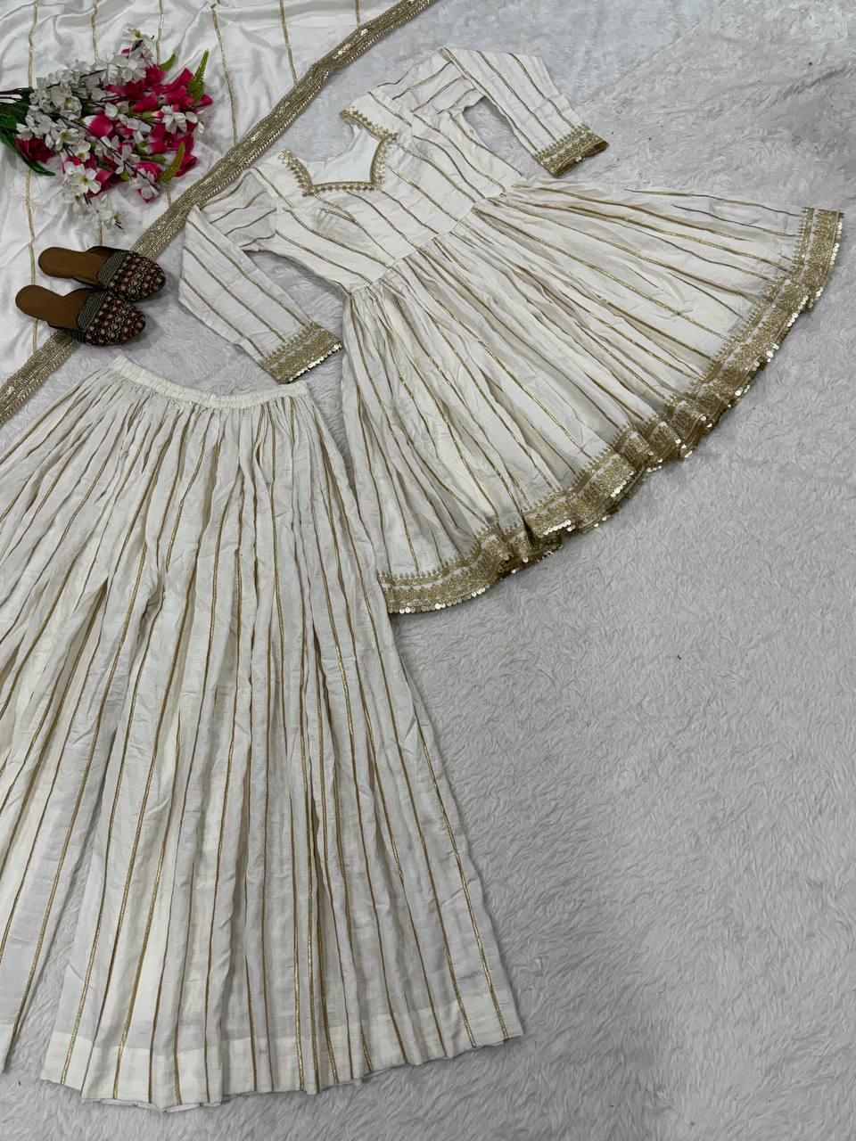 Radiant Rose Pink Flared Peplum Kurti and Sharara Set Embellished with Luminous Gold Zari Stripes and Sequined Borders